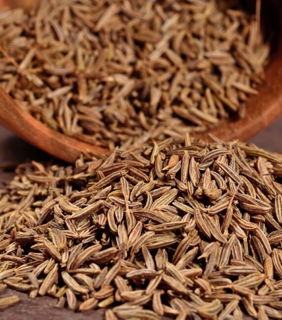 Cumin seeds in a wooden bowl