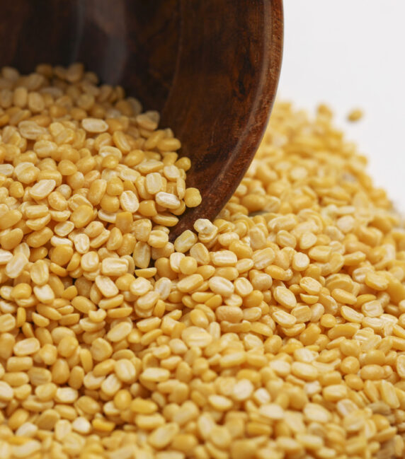 yellow moong mung dal lentil pulse bean in wooden bowl on white yellow moong mung dal lentil pulse bean in wooden bowl on white background