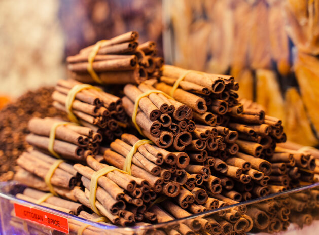 Cinnamon sticks cassia aromatic spice Turkish market. Seasoning for mulled wine and desserts.