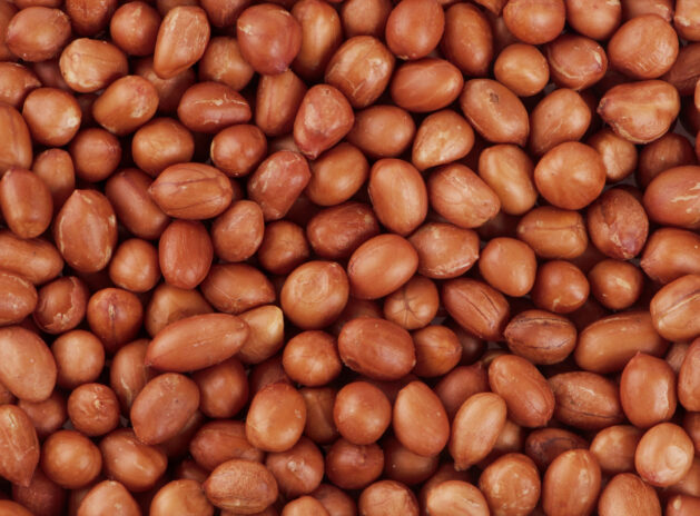 Close up peanuts background, top view, food background.